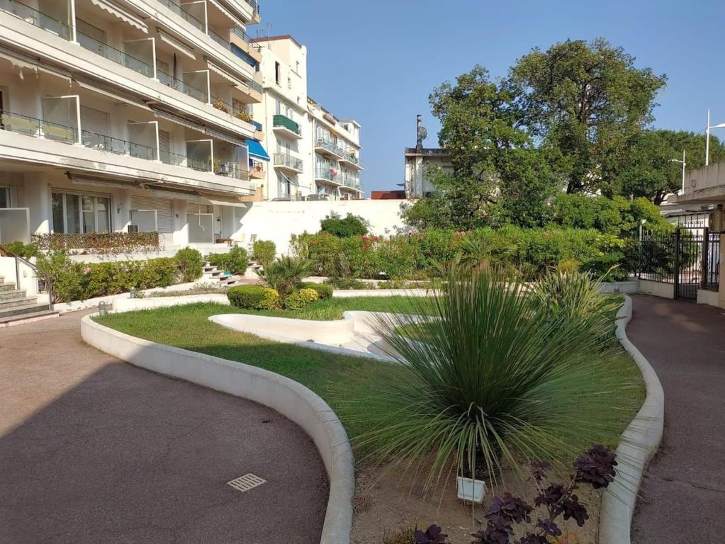 a garden in the middle of a building at Flat in Juan in Antibes
