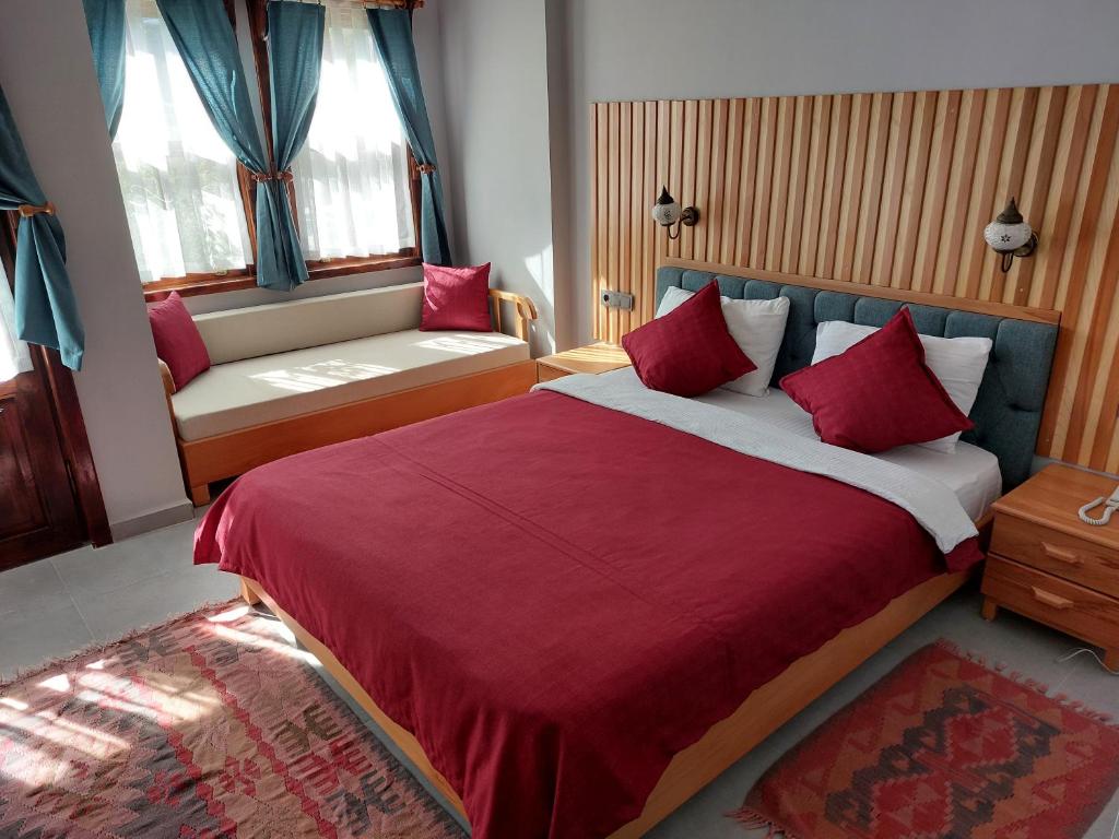 Postel nebo postele na pokoji v ubytování Nerissa Hotel