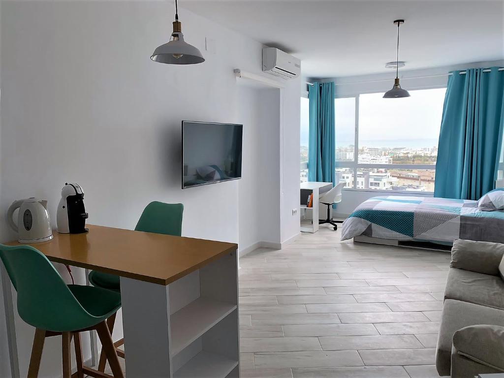 Televízia a/alebo spoločenská miestnosť v ubytovaní Aqua Apartment