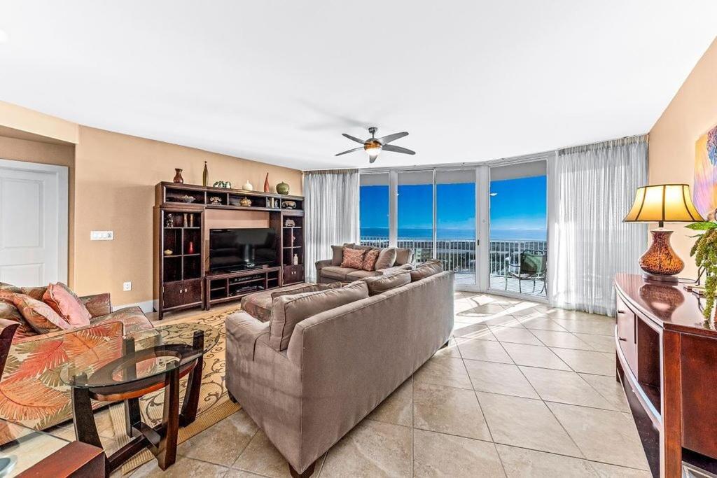 a living room with a couch and a television at Caribe Resort Unit C814 in Orange Beach