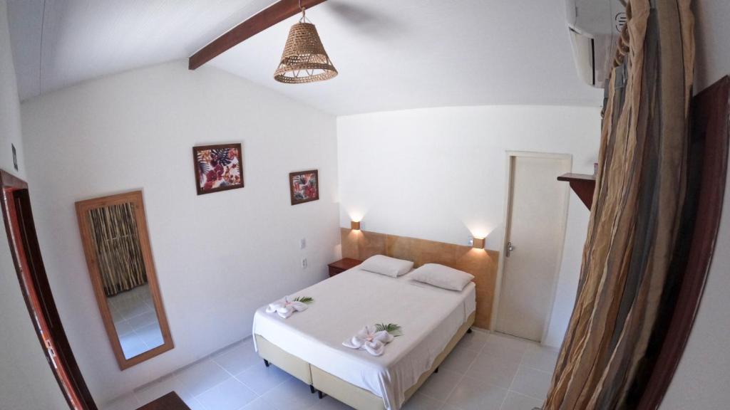 Cama ou camas em um quarto em Pousada Wind Paracuru