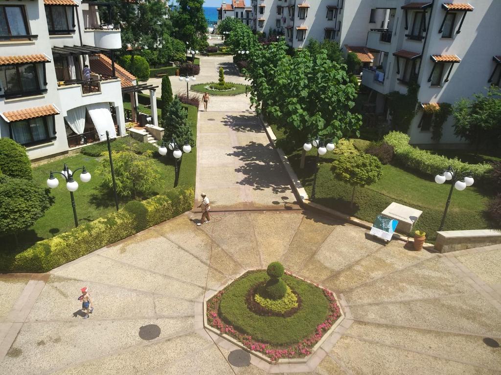 an overhead view of a park with a fountain and a garden at Oasis Resort & Spa 2 floor with sea view Gen in Lozenets