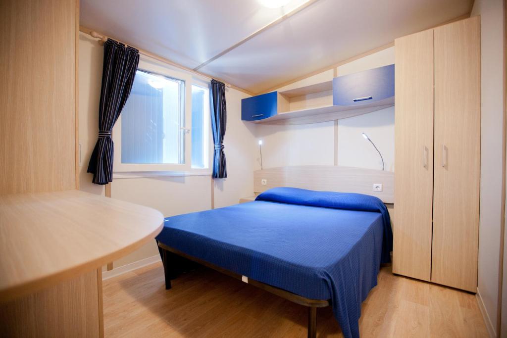 Postel nebo postele na pokoji v ubytování Camping Blu Fantasy