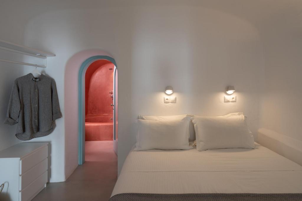 Postel nebo postele na pokoji v ubytování Valsamo Suites