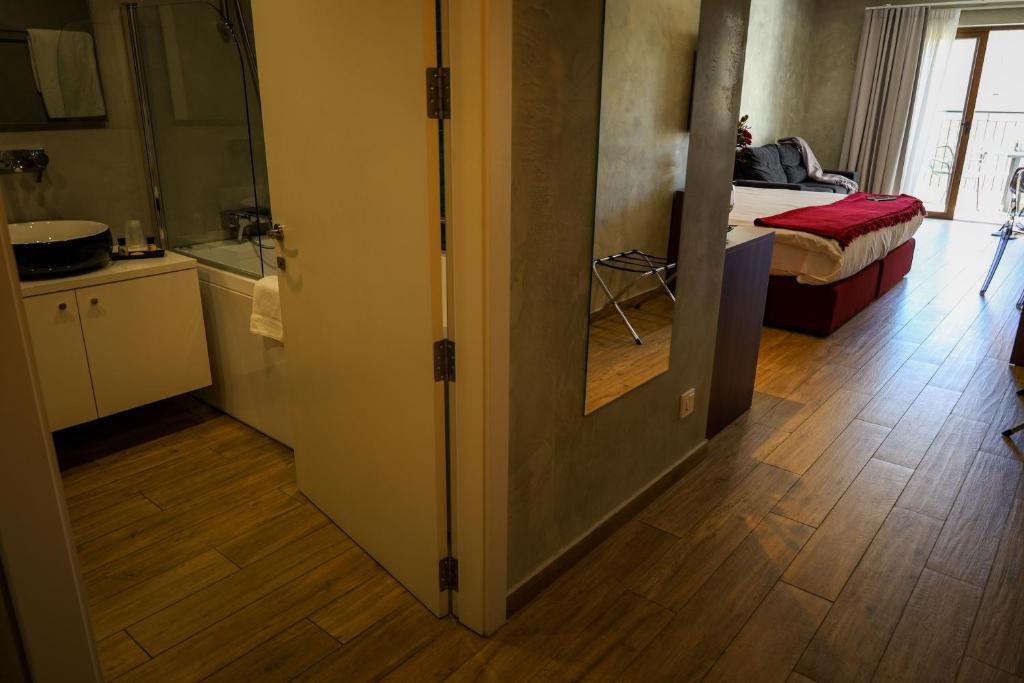 Postel nebo postele na pokoji v ubytování Adelphi Boutique Hotel