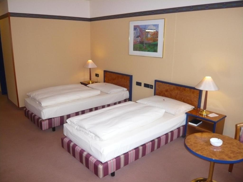 Postel nebo postele na pokoji v ubytování Hotel Falkenstein