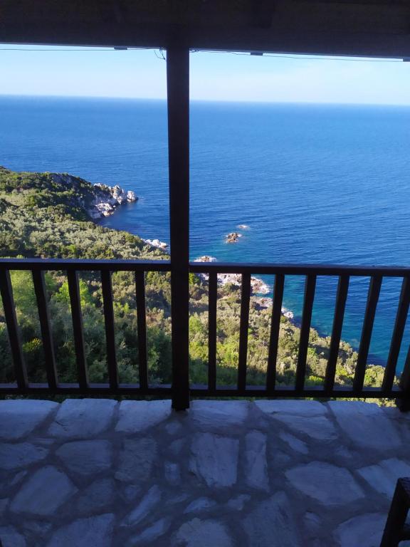 a view of the ocean from a balcony at Triple studio room with the most beatifull view in Mylopotamos in Tsagarada