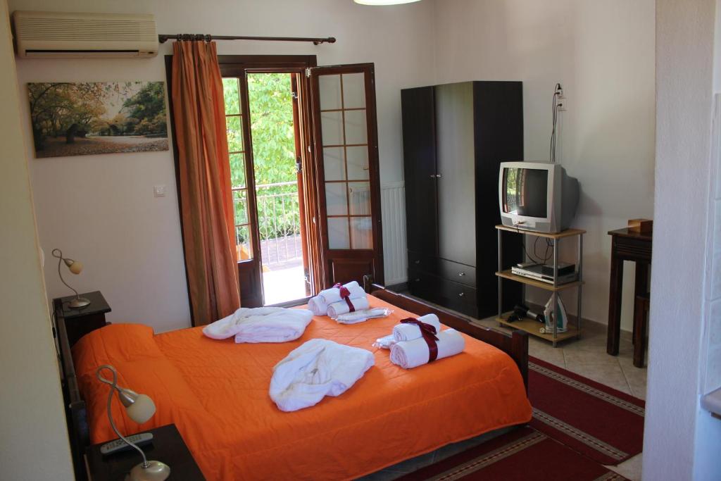 Postel nebo postele na pokoji v ubytování Artemis Apartments