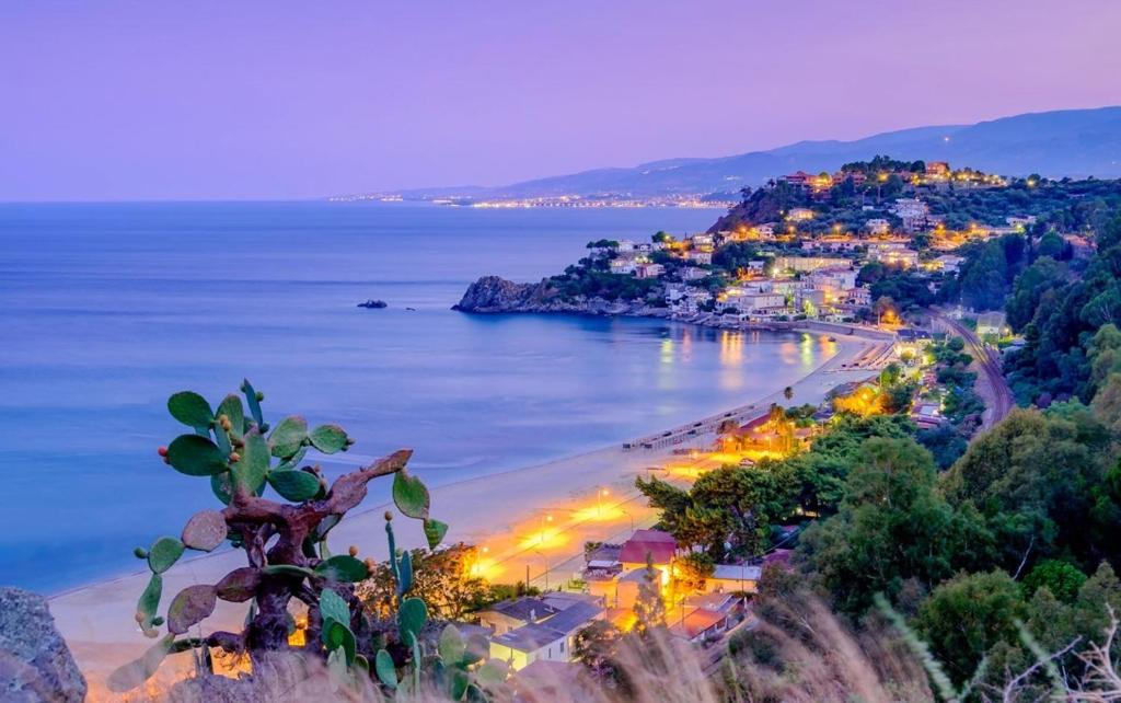 a view of a beach at night at Alepou Guest House in Gasperina