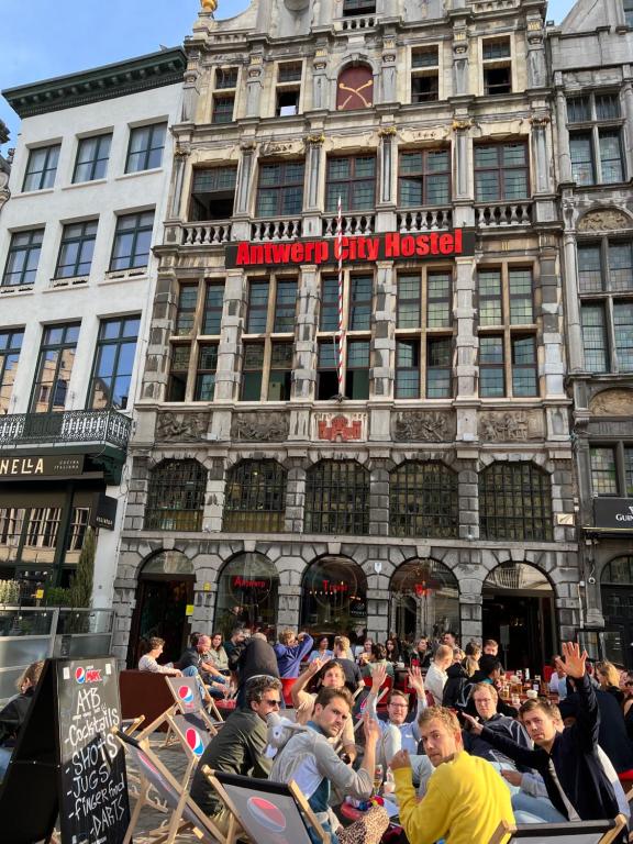 a crowd of people standing in front of a building at Antwerp City Hostel in Antwerp