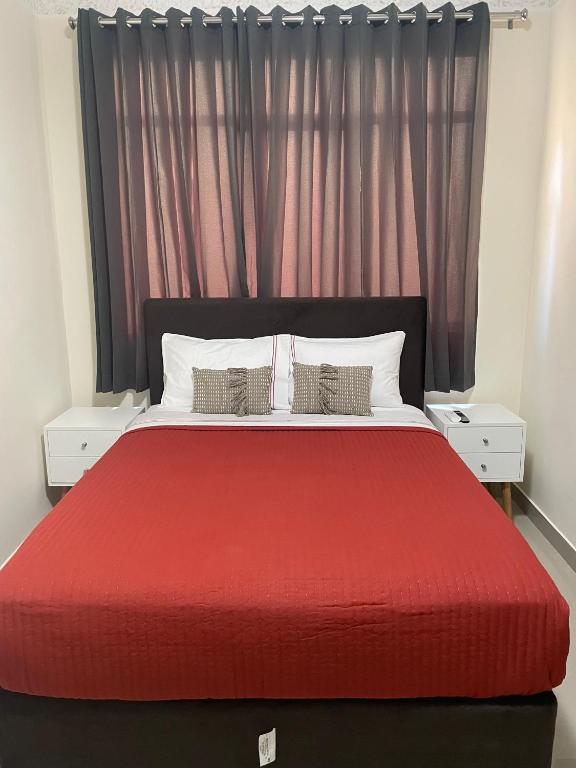 Rúm í herbergi á Hotel Calmelia