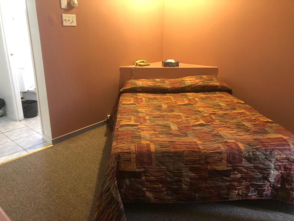 Postel nebo postele na pokoji v ubytování Motel Le Voyageur