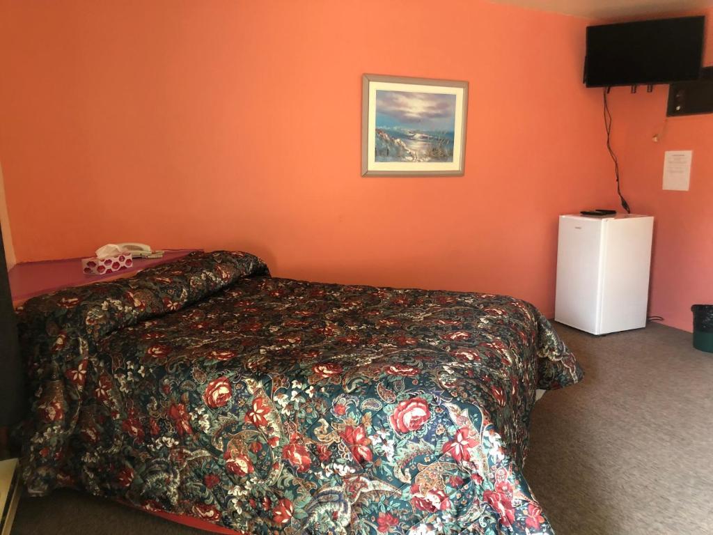 Postel nebo postele na pokoji v ubytování Motel Le Voyageur