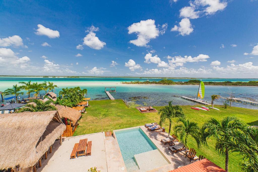 an aerial view of a resort with a body of water at Hotel CasaBakal - A pie de Laguna - Bacalar in Bacalar