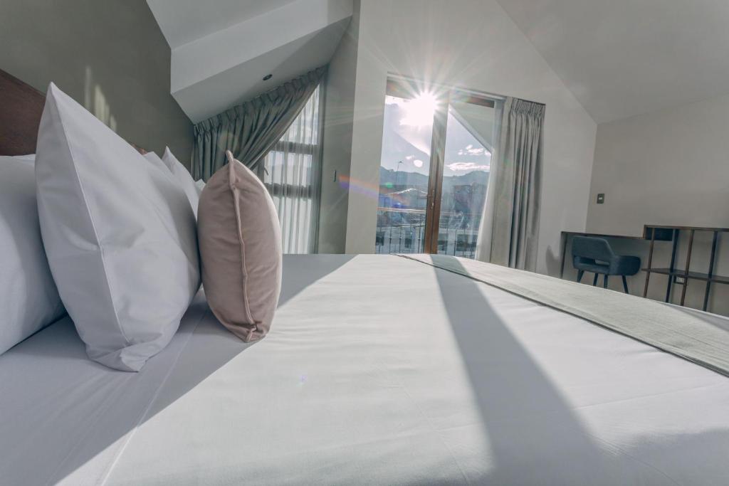 Saska Boutique Hotel客房内的一张或多张床位