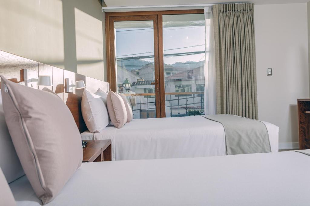 Saska Boutique Hotel客房内的一张或多张床位