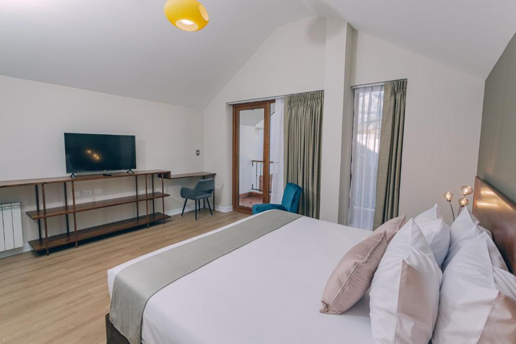 Saska Boutique Hotel客房内的一张或多张床位