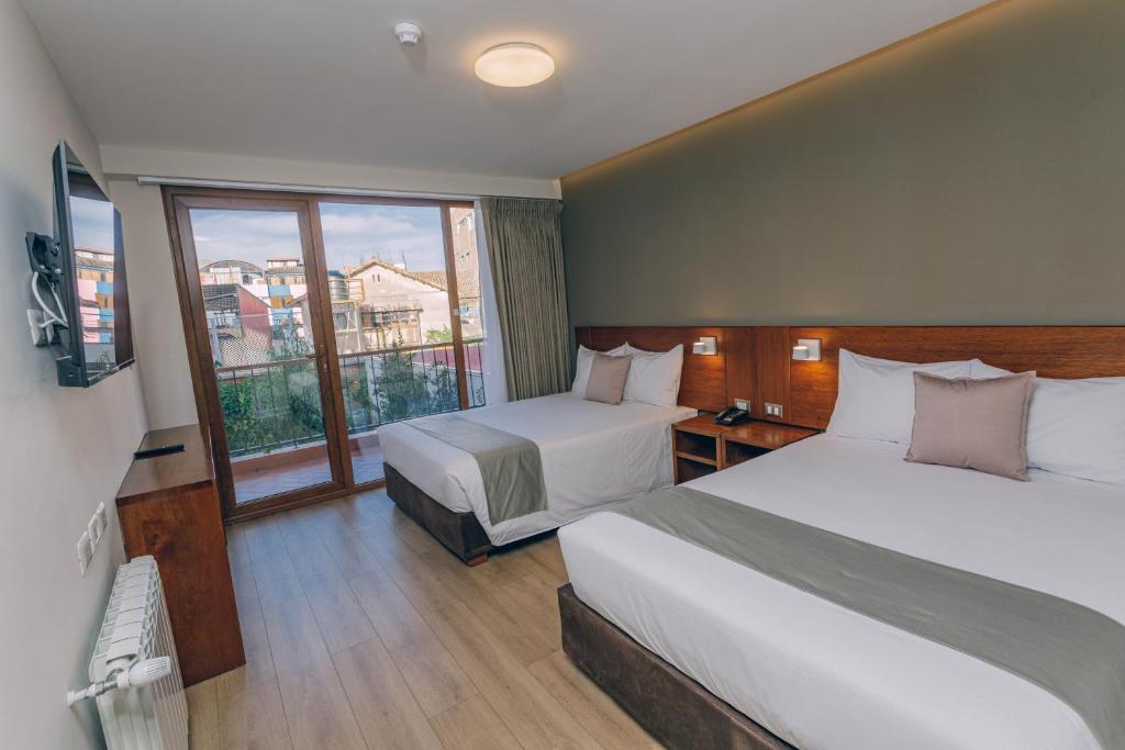 Saska Boutique Hotel客房内的一张或多张床位