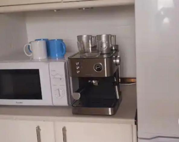 Kuchyň nebo kuchyňský kout v ubytování APARTAMENTO- ATICO EN MIJAS COSTA , CON PISCINA.