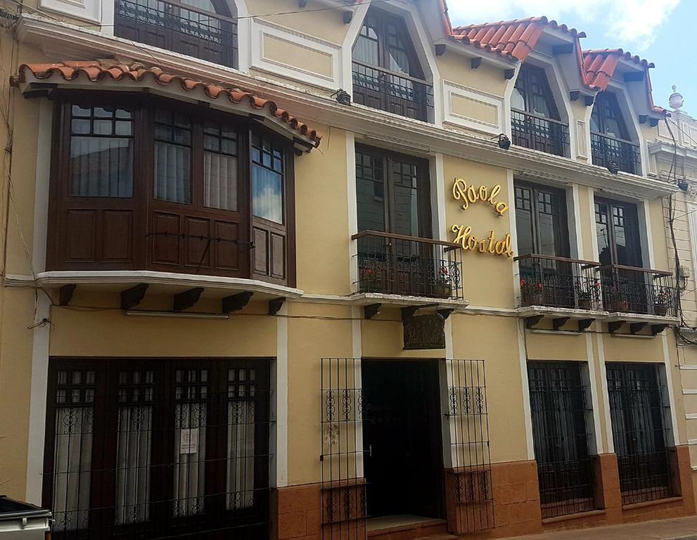 a building with balconies on the side of it at Hostal Paola in Sucre