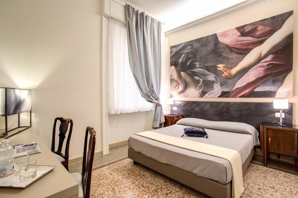 Posteľ alebo postele v izbe v ubytovaní Roma In Una Stanza Guesthouse