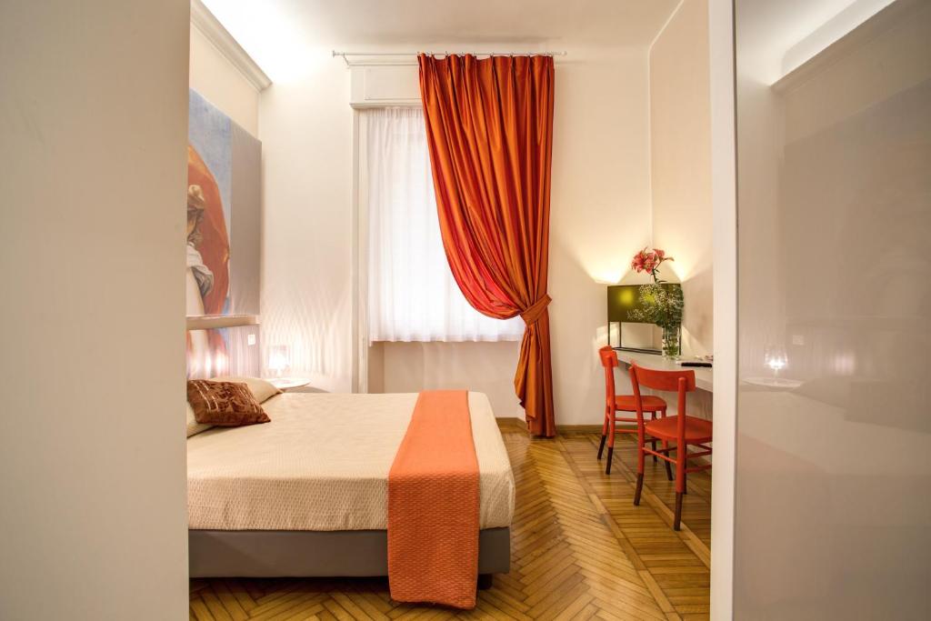 Posteľ alebo postele v izbe v ubytovaní Roma In Una Stanza Guesthouse