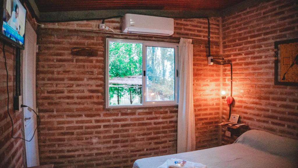 Postel nebo postele na pokoji v ubytování Hotel alamos de la puntilla