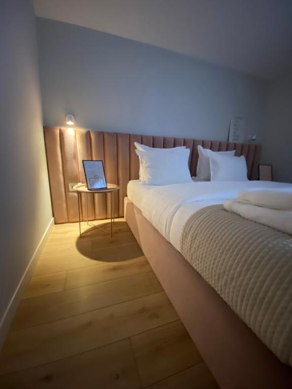 Postel nebo postele na pokoji v ubytování Living Studio Apartments