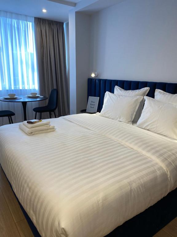 Postel nebo postele na pokoji v ubytování Living Studio Apartments