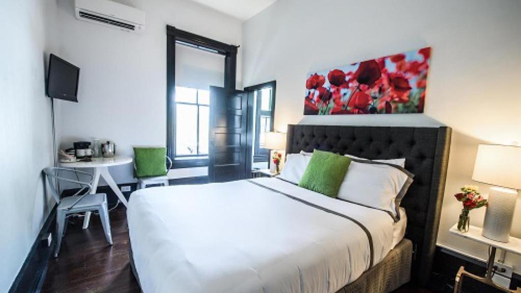Postel nebo postele na pokoji v ubytování Hotel Giles
