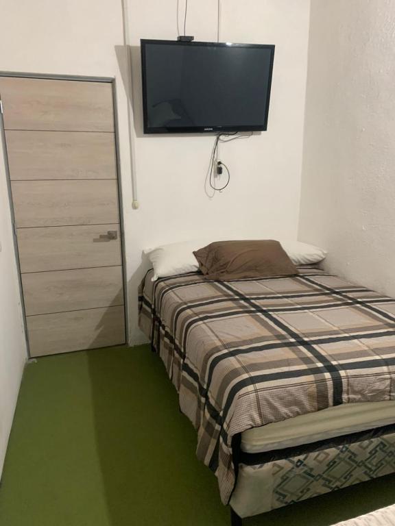Postel nebo postele na pokoji v ubytování Hotel Chulamar, Piscina y Restaurante