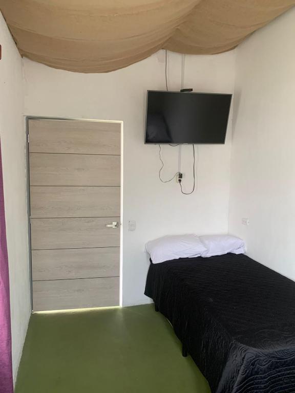 Postel nebo postele na pokoji v ubytování Hotel Chulamar, Piscina y Restaurante