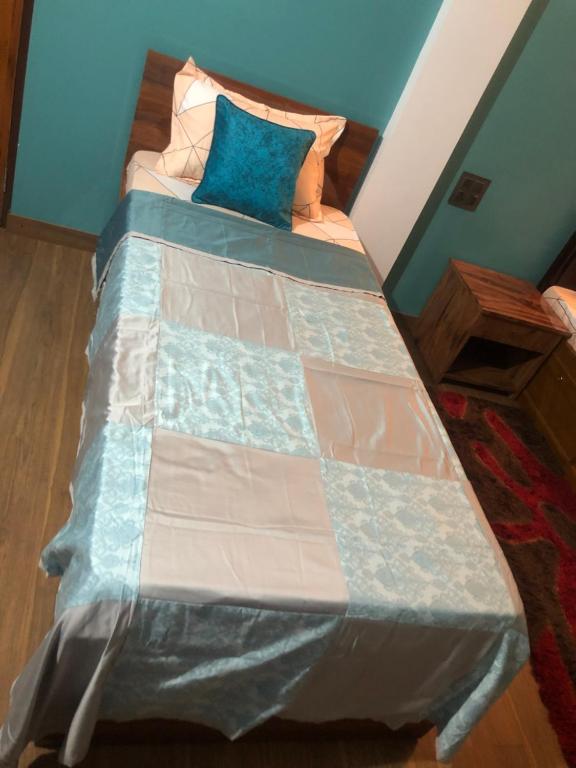 Postel nebo postele na pokoji v ubytování Maple Homestay
