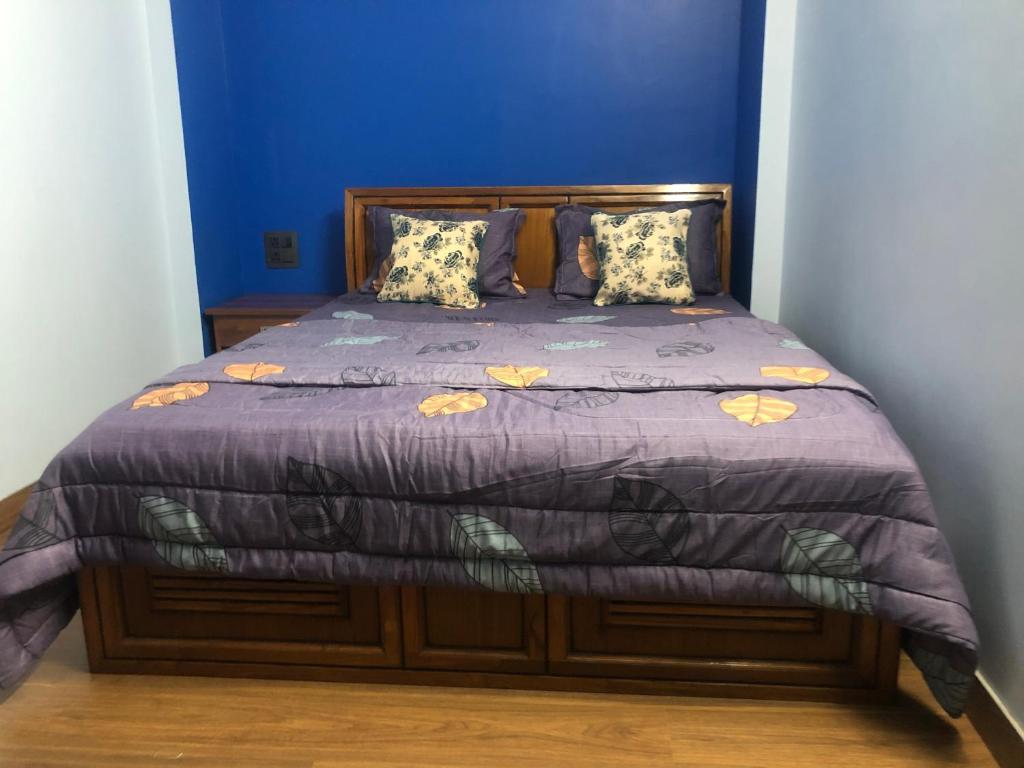 Postel nebo postele na pokoji v ubytování Maple Homestay