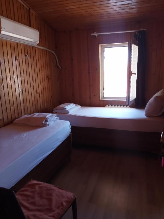 Postel nebo postele na pokoji v ubytování GÜVEN HOTEL