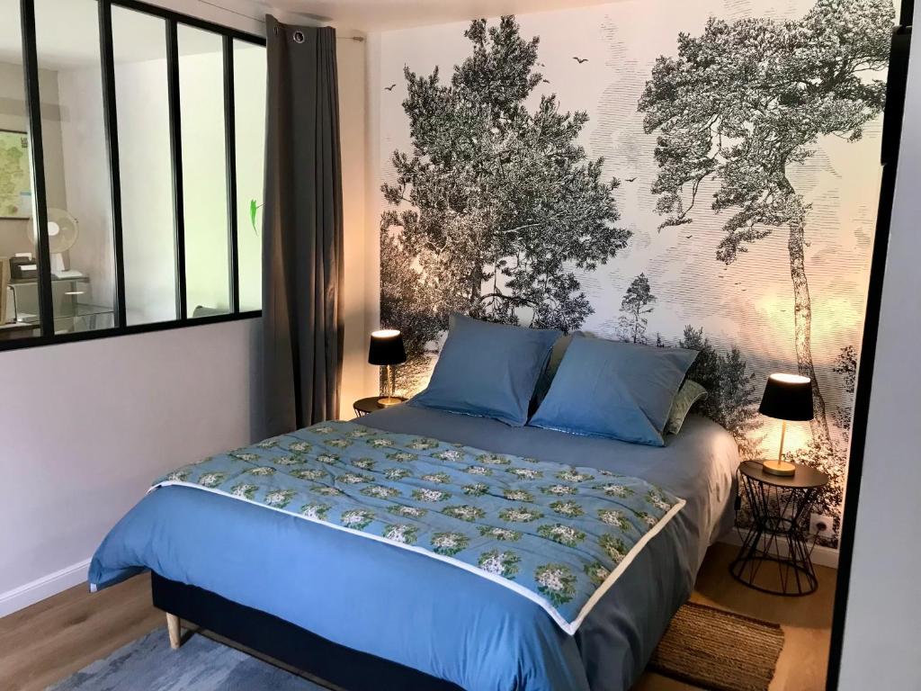 Ένα ή περισσότερα κρεβάτια σε δωμάτιο στο Petit Loft idéal, Tourisme et Affaires en Vallée du Lot