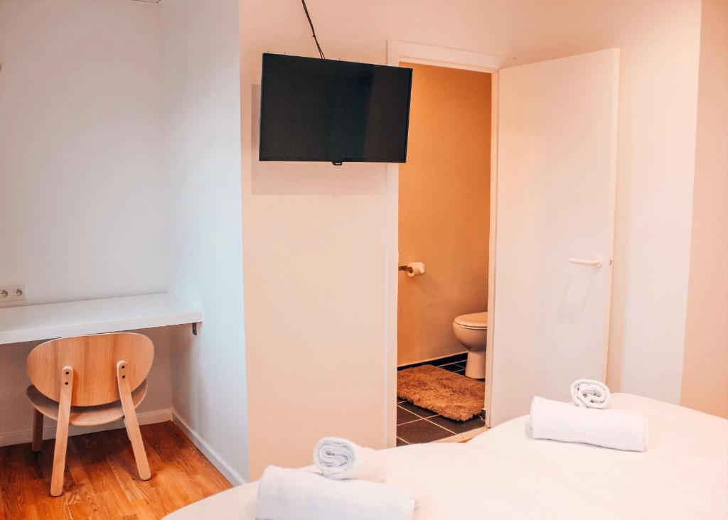 Postel nebo postele na pokoji v ubytování Alpha Hotel