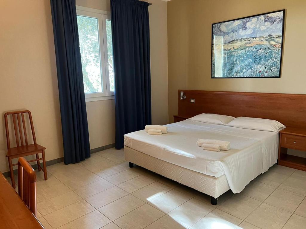 Postel nebo postele na pokoji v ubytování Hotel Adriatico