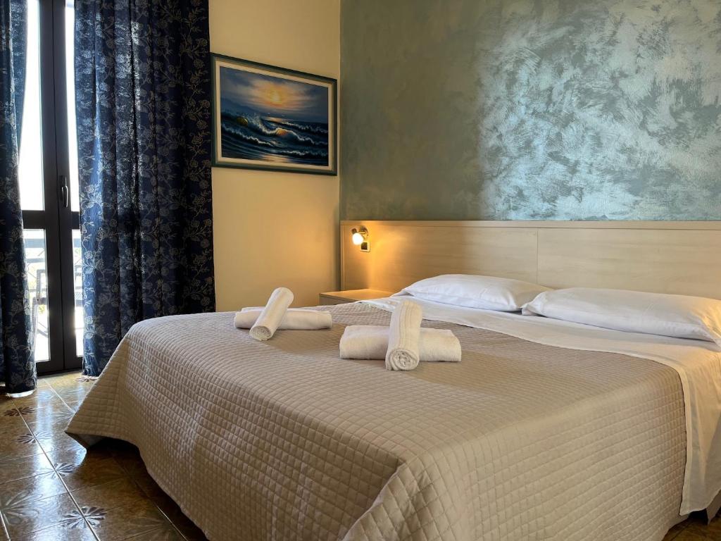Postel nebo postele na pokoji v ubytování Hotel Renata