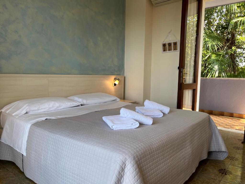 Postel nebo postele na pokoji v ubytování Hotel Renata
