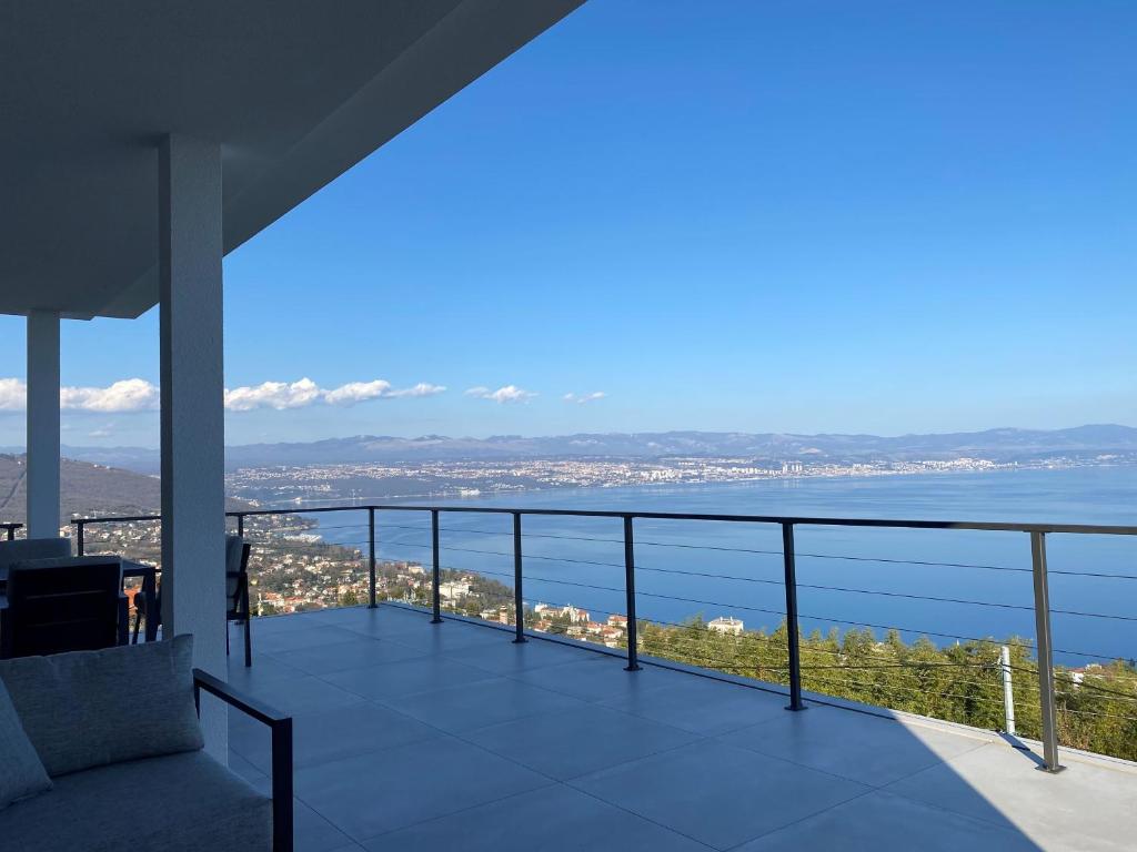 a balcony with a view of the water at Kvarner Luxury Loft in Lovran