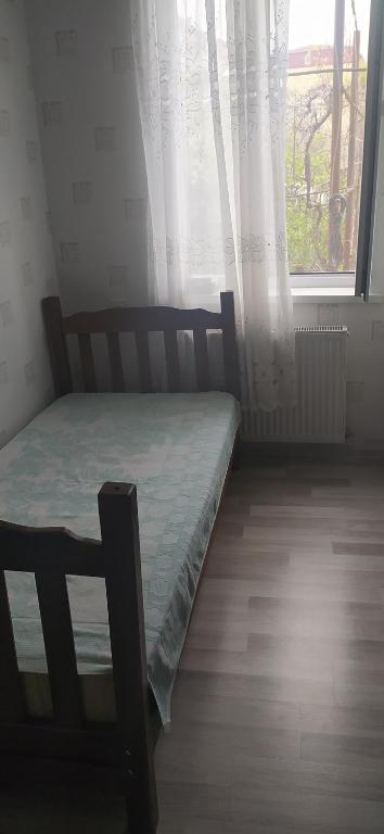 Postel nebo postele na pokoji v ubytování GEO Vake Guest House