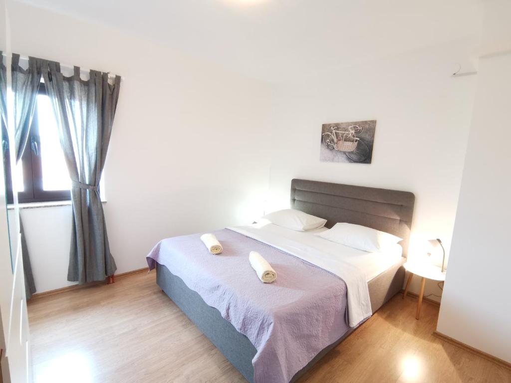 Posteľ alebo postele v izbe v ubytovaní Apartman Sintić