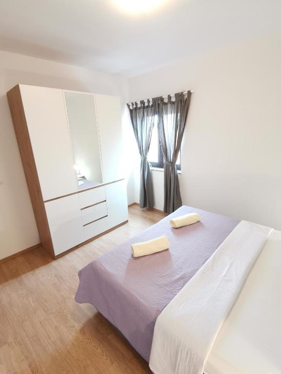 Posteľ alebo postele v izbe v ubytovaní Apartman Sintić