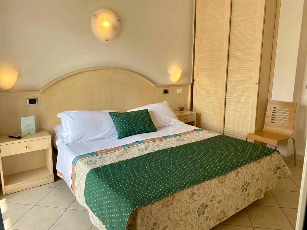 Postel nebo postele na pokoji v ubytování Hotel Granada
