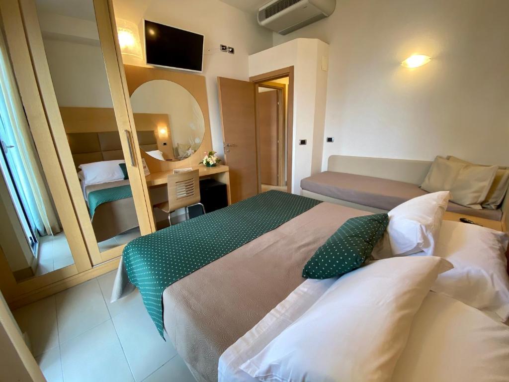 Postel nebo postele na pokoji v ubytování Hotel Granada