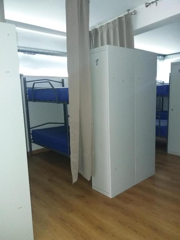 Postel nebo postele na pokoji v ubytování Albergue Monterrey