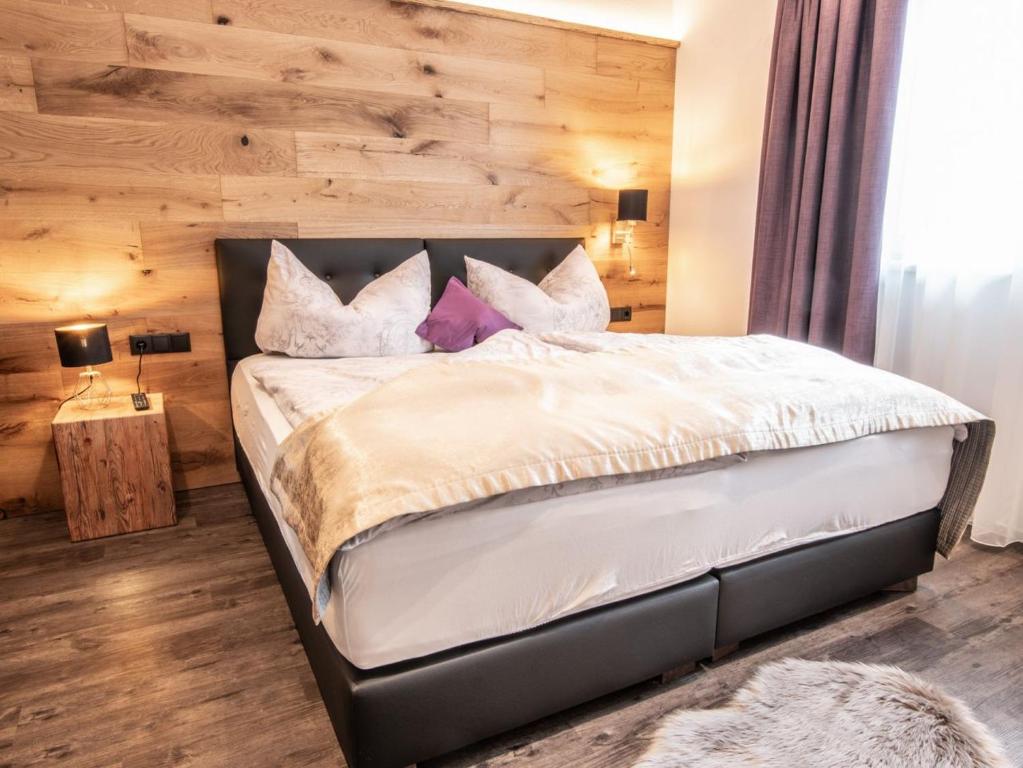 Llit o llits en una habitació de ApartKlusiv Kaltenbach
