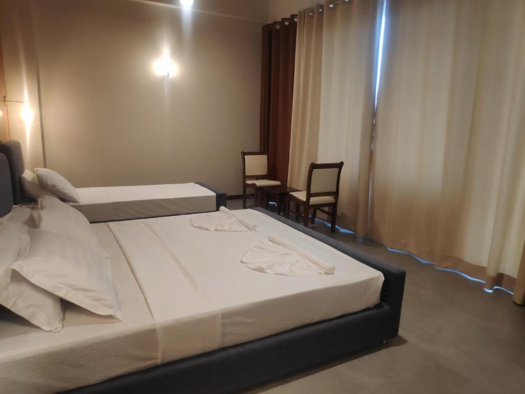 Postel nebo postele na pokoji v ubytování Sooriya Wessagiri Resort