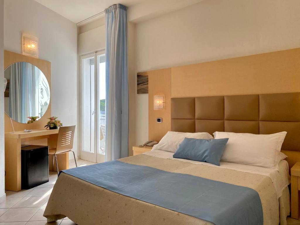 Postel nebo postele na pokoji v ubytování Hotel Granada